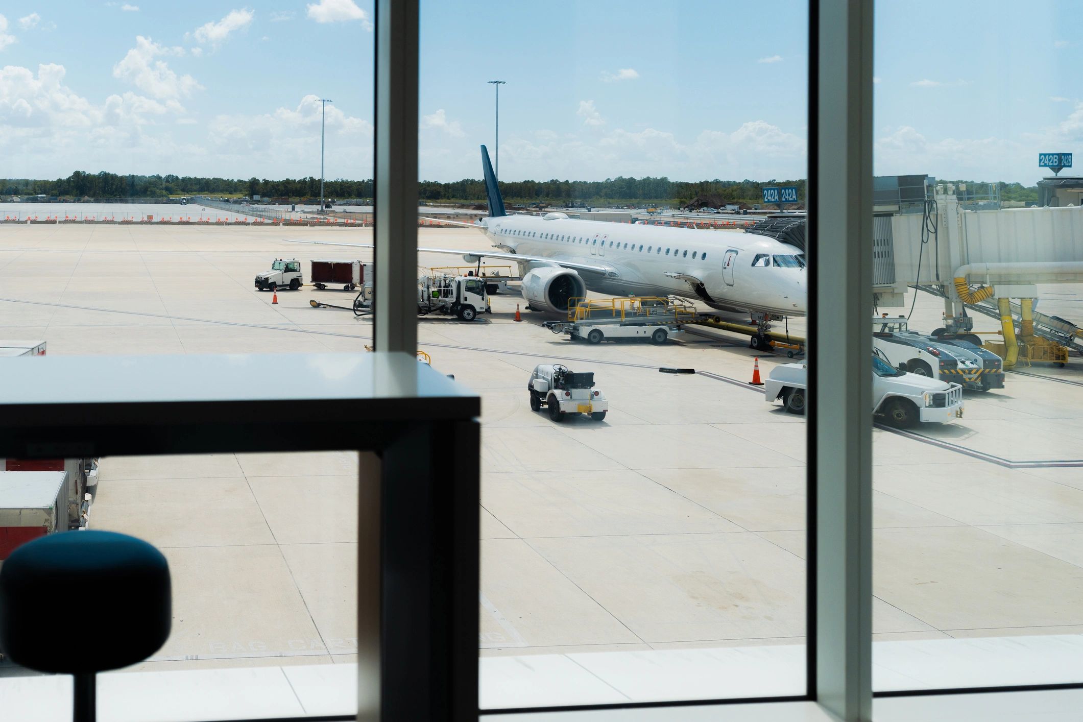 Airport apron and aircraft viewed from terminal